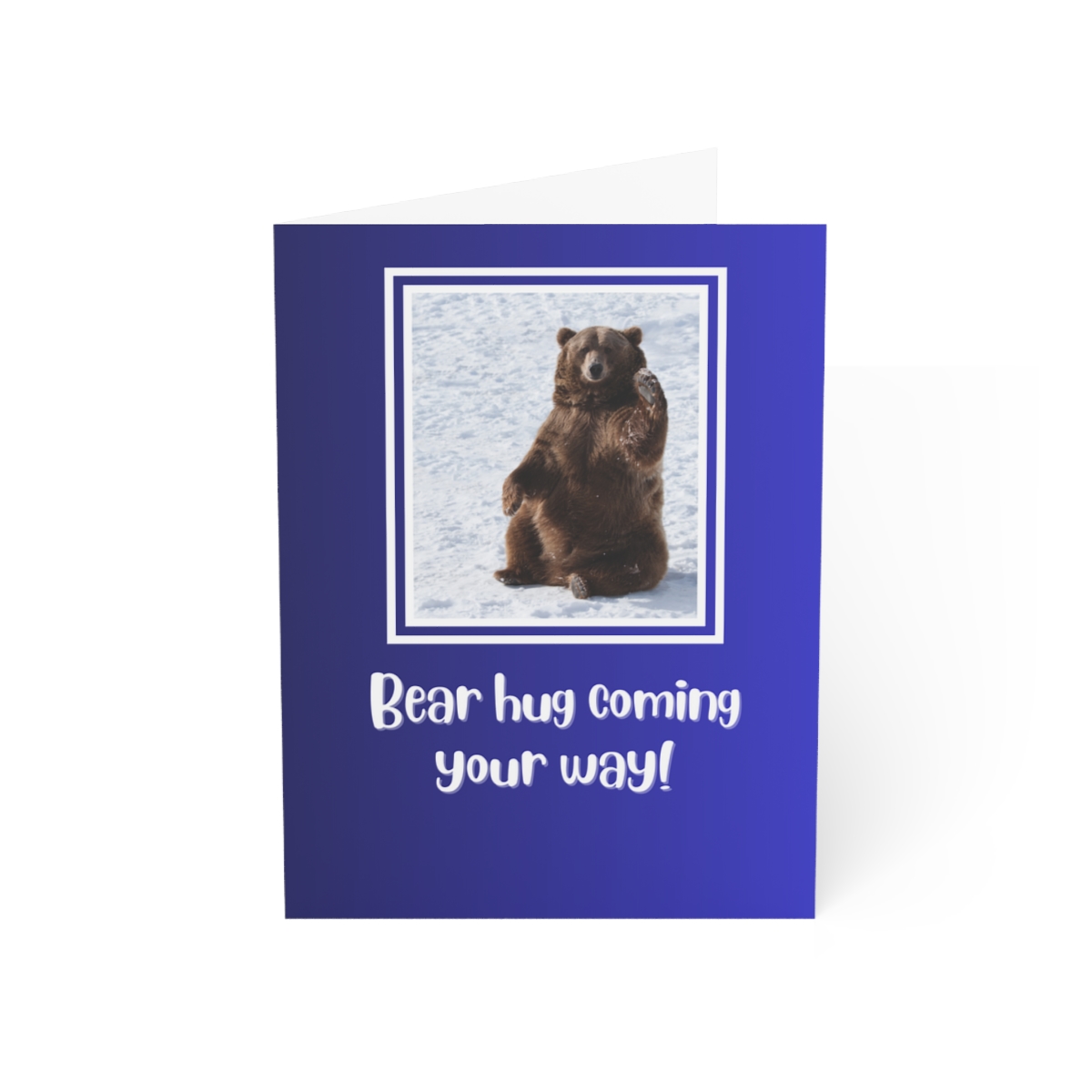 image shows the front of the bear hug card. A bear sits on the snow with his paw raised as if sending a wave. Text reads "Bear hug coming your way!"